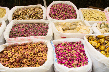 Close-up of various health dry tea herbs: hawthorn, dried rose, mangosteen, dried chrysanthemum, dried lemon slices, etc., top view
