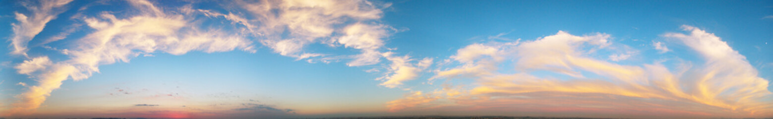 Orange clouds in blue sky, natural scenery
