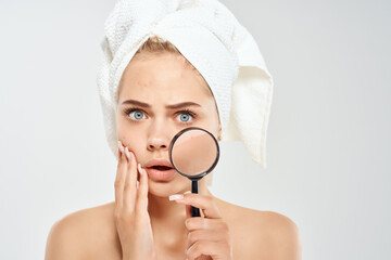 woman holding behold face loupe dermatology close-up clean skin