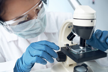 woman laboratory assistant microscope diagnostics research science