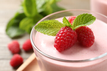 Glass of delicious raspberry mousse with mint, closeup