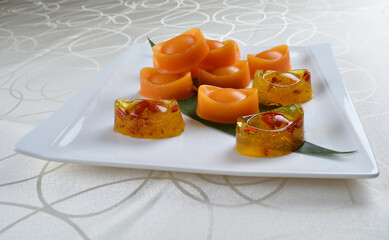 chinese sticky sweet brown sugar glutinous rice Nian gao in traditional money yuan bao and cute pig shape design asian dessert halal menu for chinese new year festival