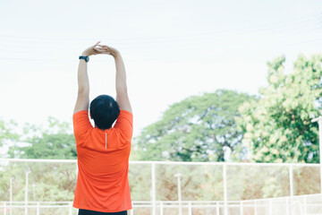 young woman stretching shoulders