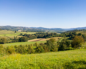 Scenic view of hilly countryside in village of Gornji Osječani near Doboj during clear sunny summer day.