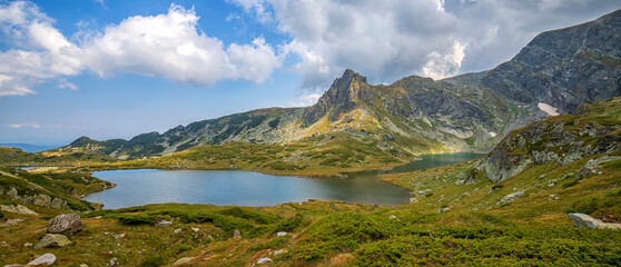 Fototapeta na wymiar Banner of lake in mountain. Bulgarian mountain Rila. Lake Bliznaka