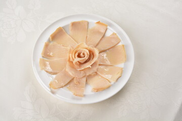 raw 10 head fresh abalone in slice and whole piece in white background asian seafood halal sashimi menu