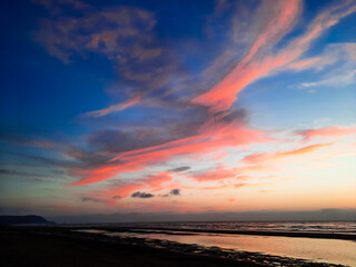 Fototapeta na wymiar Sunset by the sea with beautiful sky