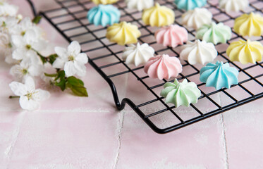 Multicolored meringue on a baking rack