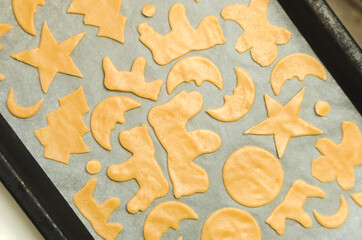 Christmas cookie cutter shapes on raw dough
