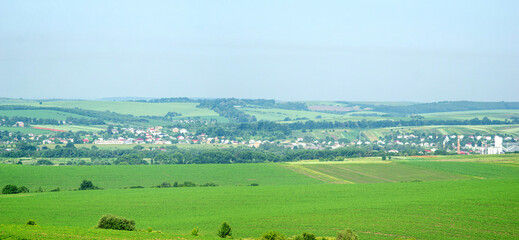 Obraz premium Small town Rohatyn in Ukraine among fields and hills on a summer day