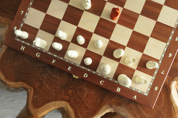 chess on wood table with box