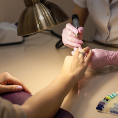 Manicure. Processing of nails by a nail file. Square formate