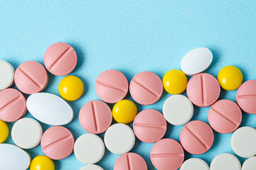 Many colorful pills macro.