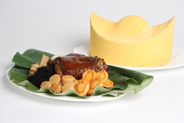 cny premium braised trotter pork leg with mixed seafood abalone, scallop, sea cucumber in handmade yuan bao money shape stone asian festive menu