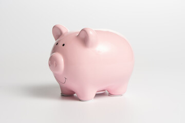 Pink piggy bank on a white background