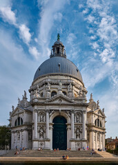 Fototapeta na wymiar Beautiful view of iconic basilica di Santa Maria della Salute or St Mary of Health by waterfront of Grand Canal, Venice, Italy.