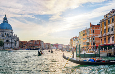 Obraz premium Romantic view of Grand Canal, Venice, Italy. Basilica di Santa Maria della Salute or St Mary of Health, colorful palaces by waterfront, many gondolas