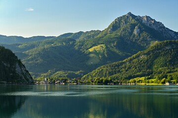 Fototapeta na wymiar Beautiful landscape with lake and mountains in summer. Natural colorful background. Wolfgangsee lake in the Austrian applause.