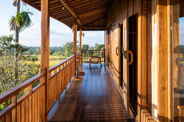 Large balcony in a wooden house with a beautiful view