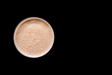 top view of espresso martini cocktail or coffee drink on black background