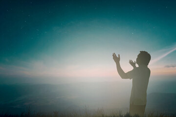 Happy man rise hand Worship God in morning view. Christian spirit prayer praise on good friday...