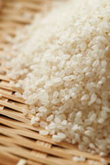 white rice on wooden background 