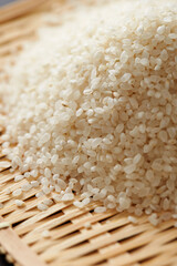 white rice on wooden background 
