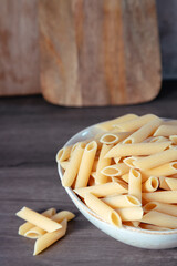 pasta plate raw macaroni on wooden table