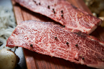 fresh raw beef on a chopping board