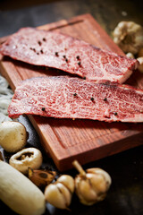 fresh raw beef on a chopping board