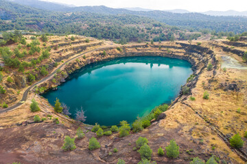 Lake in abandoned open pit of Pythorachoma copper mine near Kapedes, Cyprus