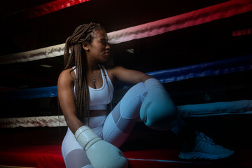 portrait of young black woman in boxing ring