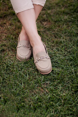 stylish female shoes on grass