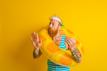 man with life buoy and princess crown takes care of his nails