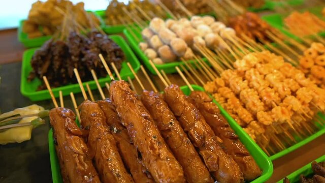 indonesian food in traditional restaurant. angkringan java cuisine. various skewer
