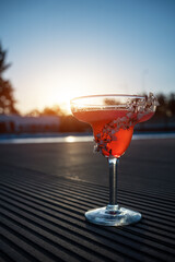 hemingway daiquiri cocktail drink with grapefruit in glass outdoor at sunset
