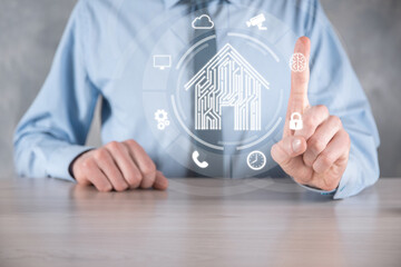 Businessman hold house icon.Smart home controlled, intelligent house, and home automation app concept.Pcb design and person with smart phone. Innovation technology internet Network Concept.