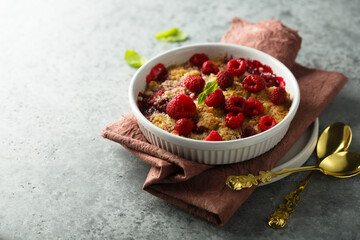Traditional homemade raspberry crumble with fresh mint