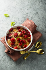 Traditional homemade raspberry crumble with fresh mint