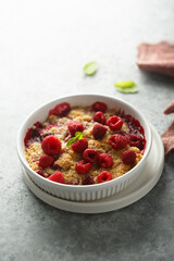 Traditional homemade raspberry crumble with fresh mint