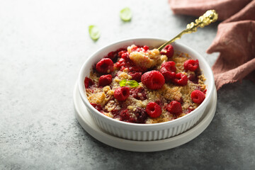 Traditional homemade raspberry crumble with fresh mint