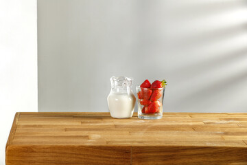 Fresh red fruits and wooden desk of free space 