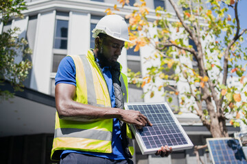 solar power plant engineers and examining photovoltaic panels. Concept of alternative energy and its service. Electrical and instrument technician.