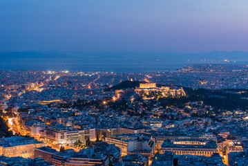 Aerial view of Athens city and Acropolis illuminated after sunset, Greece