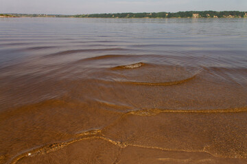 natural background with a river lagoon, a sandy shore and a horizon