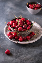 Plate of juicy fresh ripe cherries close up