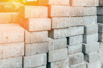 Gray silicate bricks are stacked. Industrial background. Concept of construction.