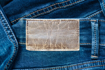 Label or leather label on jeans with space to copy. Blank for applying information. Casual...
