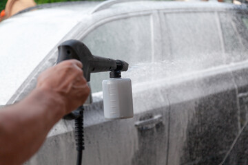 Washing modern car with detergent