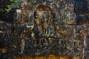 The engraved pattern around Angkor Wat belongs to the Khmer Empire. Located in the center of Angkor Thom